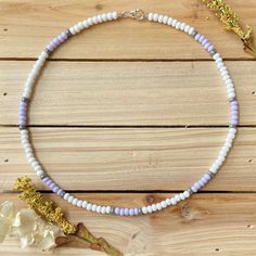 The Lavender Dream beaded choker is just what you need for any occasion that might come your way. This sublet necklace is perfect for a winter day at home or a sunny day on the beach. All chokers are customizable to the size you need so please be sure to measure your neck where you want your choker to sit and order accordingly! This high quality beaded choker is beautiful worn on its own or layered. It is secured with a sterling silver lobster claw and made with glass beads that can stand the te Adjustable Purple Choker With Colorful Beads, Purple Beaded Choker With Round Beads, Summer Purple Beaded Necklaces With Colorful Beads, Summer Purple Beaded Necklace With Colorful Beads, Purple Tiny Beads Necklace For The Beach, Purple Tiny Beads Necklace For Beach, Handmade Adjustable Lavender Beaded Necklaces, Handmade Lavender Beaded Necklaces, Adjustable Purple Beaded Necklace With Heart Beads