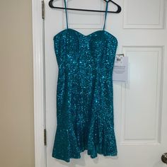 Nwt! Size 6. The Prettiest Teal I Bought For A Formal And Ended Up Not Wearing It. Too Pretty To Be Sitting In My Closet! I Included Pictures With And Without Flash. This Is Strapless And Has A Little Bra Inside Blue Fit And Flare Party Mini Dress, Blue Mermaid Hem Dress For Party Season, Blue Mini Dress For Holiday, Blue Mini Dress For Holidays, Spring Cocktail Dress With Mermaid Hem, Blue Mini Holiday Dresses, Holiday Blue Mini Dresses, Spring Party Mini Dress With Mermaid Hem, Fitted Blue Mini Dress For Holiday