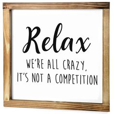 a sign that says relax we're all crazy, it's not a competition