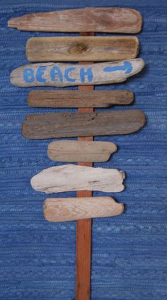 a wooden sign sitting on top of a blue rug