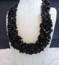 "This necklace is made with 5 separate strands of black onyx chips and crystal clear seed beads. The individual strands are then braided to give a stunning result. It is 19 inches in length and fastens with a silver tarnish resistant toggle. It is a simple, but striking necklace that you will enjoy for many years. Matching earrings are my gift to you. Item Features: - Handmade necklace - 19\" long - 5 strands - Black Onyx chips - Matching earrings - Toggle closure Processing Time: These items ar Coral Jewelry Set, Turquoise Jewelry Set, My Gift, Onyx Jewelry, Coral Jewelry, Handmade Beaded Jewelry, Pink Jewelry, Pink Necklace, Earrings Unique