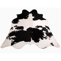 a black and white cowhide rug on a white background