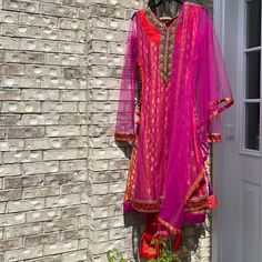 Absolutely Stunning Embroidery On This Churidar Set Perfect For Weddings , Sangeet Adjustable Side Drawcords / Tassels Churidar Pants Are Plain Red Never Worn Dry Clean Only Please Check The Approximate Measurements Carefully Before Purchase . Length - 43”. Pit To Pit - 19” Pink Sets With Intricate Embroidery For Traditional Ceremonies, Pink Unstitched Suit With Dabka Work For Traditional Ceremonies, Red Unstitched Suit With Sheer Dupatta, Semi-stitched Red Unstitched Suit With Sheer Dupatta, Festive Salwar Kameez With Sheer Dupatta For Traditional Ceremonies, Long Embroidered Pink Salwar Kameez, Churidar With Sheer Dupatta For Festivals, Red Fitted Churidar With Sheer Dupatta, Red Anarkali Set For Eid And Traditional Ceremonies