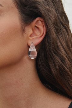 Elevate your accessory game with the Teardrop Stud Earrings. Their sleek, teardrop shape adds a touch of sophistication, making them the perfect finishing touch for any outfit. Product code: CAC01A4G004CC Features:  Material: 100%RESIN. Modern Single Teardrop Long Drop Earring, Modern Clear Drop Jewelry, Minimalist Teardrop Earrings For Party, Formal Clear Teardrop Earrings, Modern Pierced Drop Teardrop Earrings, Single Teardrop Earring For Party, Modern Clear Teardrop Jewelry, Modern Teardrop Earrings, Modern Teardrop Earrings With Crown