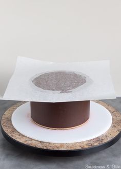 a white plate topped with a brown hat