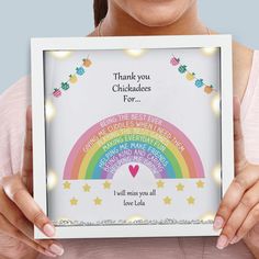 a woman holding up a framed photo with the words thank you chocolates for