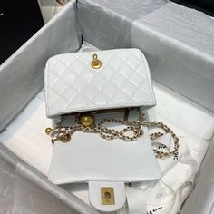 Description   CC Mini Flap Bag With CC Ball On Strap White For Women, Women’s Handbags, Shoulder And Crossbody Bags 6.7in/17cm AS1786  Rep 1:1  Measurements: 17 x 7 x 12 cm / 6.7 x 2.7 x 4.7 inches (Length x Width x Height)  White  Gold-toned hardware  Adjustable chain shoulder strap  Beautifully structured flap-over design  Inside zipped pocket  Includes box, dust bag.  This product is of the best quality. Chanel Mini Flap Bag, Baby Tote Bag, Louis Vuitton Shirt, Chanel Mini, Stylish Handbags, Chanel Bags, Evening Clutch Bag, Tote Backpack, Chanel Handbags