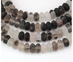 three strands of black and white glass beads