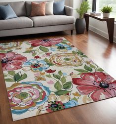 a living room filled with furniture and a flower rug