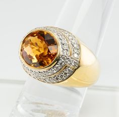 Genuine Citrine, Orange Citrine Ring, Natural Citrine Band, Natural Diamond Ring, Genuine Diamond Band, Natural Diamonds, 18K Gold Ring by Kristina, November Birthstone, Orange Ring, Domed Ring. This extraordinary estate ring is made by New York designer Kristina. The ring is crafted in solid 18K Gold and set with genuine Earth mined citrine and dazzling white genuine diamonds The center checkerboard cut Citrine measures 13mm x 10mm (5.45 carats). This is a vibrant warm orange/ yellow gem of gre Luxury Brilliant Cut Citrine Diamond Ring, Luxury Yellow Gold Topaz Ring With Gemstone Accents, Luxury Citrine Diamond Ring In Yellow Gold, Luxury Yellow Gold Citrine Diamond Ring, Formal Citrine Rings With Brilliant Cut, Luxury Oval Yellow Sapphire Diamond Ring, Gold Oval Gemstones With Brilliant Cut, Formal Gold Sapphire Ring With Gemstone Accents, Formal Gold Topaz Ring With Gemstone Accents