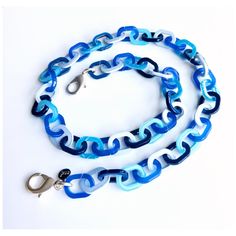 Eyeglass chain features colorful links in varying shades of blue. Available with matte silver or matte gold lobster clasps. Ultra lightweight, colorful and stylish! Choose your length from the drop down menu. Comes with one pair of rubber connectors (6 colors to choose from). Available with matte silver or matte gold lobster clasps, or no lobster clasps. If you would like your chain designed with only the rubber connectors attached (no lobster clasps), please make the appropriate selection from the drop down menu. Summer Blue Glasses Chain With Adjustable Feature, Blue Adjustable Chain Glasses Chains For Summer, Blue Adjustable Glasses Chain For Summer, Trendy Blue Glass Jewelry, Trendy Blue Glass Necklace, Blue Summer Glasses Chains, Trendy Adjustable Blue Glasses Chain, Trendy Blue Glass Glasses Chains, Blue Glasses Chains For Beach Summer