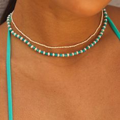 No need to choose, now you can have your two favorite beads combined in perfect harmony. This unique Turquoise Magnesite and Pearl combo with aesthetically contrasting colors bring calming vibes instantly. You'll feel the Summer sun each time your eye catches this flawless beauty, not to mention the fun you'll have mixing with other gold or Babygold bead necklaces. Pairs beautifully with our Turquoise Magnesite & Pearl Stretch Bracelet!

Size: 3-4.5mm bead size
Length: 16"
Lifetime Guarantee
Mad Turquoise Necklace With Spacer Beads For Beach, Spiritual Turquoise Beaded Necklace With Spacer Beads, Turquoise Necklace With Tiny Beads For Beach, Turquoise Beach Necklace With Tiny Beads, Turquoise Heishi Beaded Necklaces With Gemstones, Turquoise Heishi Bead Necklaces With Gemstones, Turquoise Beaded Necklaces With Gemstone Heishi Beads, Double Strand Turquoise Jewelry With Colorful Beads, Turquoise Gemstone Beaded Necklaces With Heishi Beads