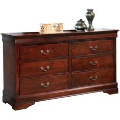 a wooden dresser with two vases sitting on top of it's sideboard