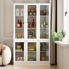 a living room filled with furniture and lots of glass shelves next to a white chair