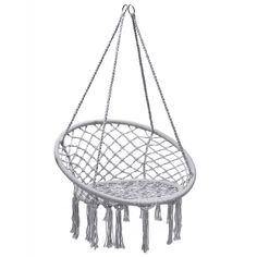 a white hanging chair with tassels on it