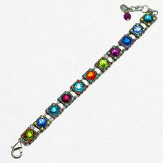 This multi-colored Firefly Rainbow Halley Bracelet is sure to adorn your wrist with a rainbow of delight. This bracelet is a beautiful blend of a contemporary color scheme paired with a classical elegance. Featuring European crystals and Czech glass, this design contains several square charms that are inlaid with a bright gem of some sort. The sparkling pieces, which is most of this bracelet, are sure to catch the light in the most dazzling way. The photos do not do the luminescence justice. You could pair this with other bracelets, but it can totally stand on its own for a moment in the spotlight. Collection: Rainbow Color: Multi-color European crystals, Czech glass Approximately 8 inches long, including a 1.25 inch extender chain Chain is silver-plated antiqued steel Bezel is silver-plat Modern Multicolor Rectangular Jewelry, Modern Multicolor Jubilee Bracelets, Modern Adjustable Multicolor Jewelry, Elegant Multicolor Rectangular Bracelet, Adjustable Multicolor Multi-stone Crystal Bracelet, Multicolor Multi-stone Adjustable Crystal Bracelet, Elegant Adjustable Rainbow Beaded Bracelets, Fusion Style Multicolor Multi-stone Bracelets, Rectangular Multicolor Bracelet