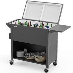 a black cart with two coolers filled with beer bottles and bowls on wheels is shown in front of a white background