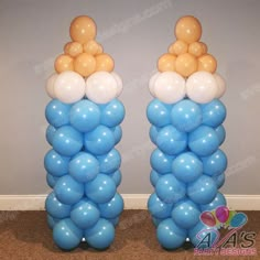 two tall blue and white balloons are on the floor