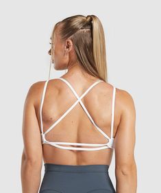 IT’S NOT YOU, IT’S YOUR SPORTS BRA With lightweight, breathable designs, comfortable cups and supportive straps, you can rely on our sports bras to be there for you, and for yours. • Did someone say back day?• Crossover strappy back• Opening inside to add removable cups SIZE & FIT• Light support• Model is 5'5" and wears size S MATERIALS & CARE• 78% Polyester , 22% Elastane SKU: B8A5U-WB57 Back Gains, Gym Jacket, Running Bra, Gym Fits, Strappy Sports Bras, White Sports Bra, Back Day, Seamless Leggings, Sports Bras