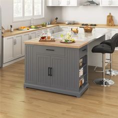 a kitchen island with two stools next to it