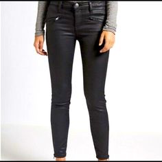 These Black Soho Zip Stiletto Coated Jeans By Current/Elliott Are A True Eighties Skinny That Hugs Every Curve. The Jeans Sit On The Ankle, Featuring A Button And Zip Fastening, Back Patch Pockets And Front Diagonal Zip Pockets. The Stilletto Jean Is Finished With A Waxy Coating And Have Side Ankle Zip Details Edgy Stretch Pants For Workwear, Chic Fitted Ankle-length Jeans, Elegant Pants With Zipper Closure For Fall, Edgy Workwear Pants With Zipper Closure, Edgy Pants With Zipper Closure For Workwear, Edgy Tapered Leg Pants, Edgy Cropped Leg Bottoms For Fall, Chic Jeans With Zipper Closure, Edgy Spring Workwear Bottoms