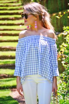 This off shoulder gingham top is effortlessly glam! We love the pastel hue and smocking around the neckline that is both cute and comfortable. Complete the look with our "Bon Bon Earrings." Chic Gingham Smocked Top For Summer, Spring Chic Gingham Smocked Top, Summer Off-shoulder Smocked Top, Off-shoulder Summer Smocked Top For Day Out, Feminine Gingham Tops For Spring, Spring Feminine Gingham Tops, Casual Gingham Smocked Top For Day Out, Casual Smocked Top For Picnic, Casual Smocked Top For Summer Picnic