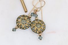 Our dainty blue and gold flower beaded earrings are handmade from lightweight czech glass dahlia shaped floral beads accented with gold filled balls and premium crystals. They are hung on gold filled ear wires. These vintage looking bohemian beauties are perfect for the summer! Grab a pair for yourself or gift them to someone special. 2.25 inches long 5/8 of an inch wideThey ship in 1 business day boxed and ready to gift if needed. Flower Beaded Earrings, Dahlia Flower, Gold Flower, Gold Flowers, Red And Gold, Beaded Flowers, Red Flowers, Ear Wires, Czech Glass