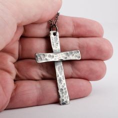 This large sized Tradition Cross is handmade of solid 925 sterling silver (92.5% pure silver) in my studio. It is hand hammered and given a dark patina to create the old vintage rustic look. Cross size: 2 1/4 inches (5.5 cm) x 1 1/4 inches (3.5 cm) Necklace chain: choose your length Handmade Sterling Silver Cross Pendant Necklace, Gift Sterling Silver Cross Necklace With Oxidized Finish, Hand Cast Cross Necklaces As Gifts, Hand Cast Cross Necklaces For Gifts, Hand Cast Cross Necklace For Gifts, Artisan Hand Forged Cross Jewelry, Hand Cast Cross Necklace For A Gift, Handmade Antique Silver Cross Necklace, Sterling Silver Hand Forged Cross Pendant Necklace