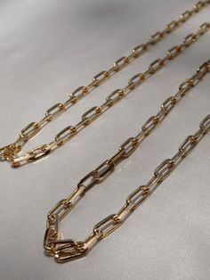 Rectangle Chain Link Necklace | Link Chain Choker | 18k Gold Filled Necklace | Medium Thick Link Chain Timeless, light & comfortable gold jewelry to wear all day, every day. Stunning piece to wear with layers, charms, or even by itself! Premium quality 18k Gold Filled Materials: Gold on Brass Measurements: Width 5mm - 16 inches long - 18 inches long Nickel & Lead Free Hypoallergenic Gold Chain Necklace With Rectangular Cable Chain Pendant, Gold Rectangular Chain Necklace In Minimalist Style, Gold Rectangular Minimalist Chain Necklace, Minimalist Gold Rectangular Chain Necklace, Gold Rectangular Cable Chain Necklace, Gold-plated Rectangular Chain Necklace With Adjustable Chain, Classic Rectangular Chain Necklace With Adjustable Chain, Gold Chunky Chain Rectangular Necklace, Rectangular Gold-tone Chain Necklace