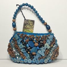 Cebu Beaded Art Signature Collection Blue Natural Wood Shell Handbag Purse NWT. *Purse Measurements: *Length: (8.75 inches) *Width: (2.75 inches) *Height: (10.5 inches) *Made in The Philippines *Clean, No Holes Tears or Breaks, No Stains Artisan Blue Pouch Bag, Handmade Blue Bucket Shoulder Bag, Handmade Blue Canvas Shoulder Bag, Handmade Blue Pouch Shoulder Bag, Blue Beaded Shoulder Bag As Fashion Accessory, Blue Bohemian Beaded Bag, Handmade Vintage Blue Shoulder Bag, Blue Beaded Shoulder Bag Gift, Blue Beaded Shoulder Bag As Gift