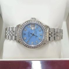 Women's Rolex 26mm DateJust Stainless Steel Watch with Powder Blue Diamond Dial and Diamond Bezel. Pre-Owned Brand: Rolex. Crystal: Sapphire. Dial: Diamond Dial. Gender: Women's. Dial Color: Powder Blue. Movement: Self-Winding. Case Dimensions: 26mm. Metal Type: Stainless Steel. Bezel: Custom Diamond Bezel. Bracelet / Strap: Original Jubilee. Box / Certificate: Rolex Box / Certificate of Authenticity. Service Warranty: One (1) Year Limited Service Warranty. NOTE: This beautiful Rolex watch inclu Rolex 26mm, Diamond Bezel Bracelet, Zenith Watches, Rolex Watches Women, Bezel Bracelet, Chanel Watch, Rolex Women, Chocolate Diamonds, White Gold Sapphire