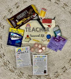 an assortment of school supplies laid out in a circle on the floor with labels and stickers