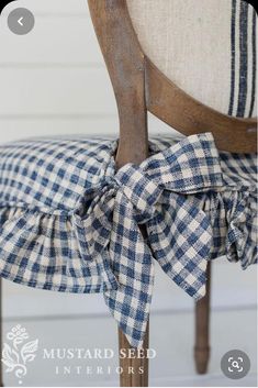 the back of a chair with a blue and white checkered bow tie on it