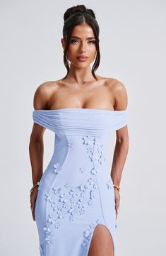 Milani is one of our dreamiest designs of the season, perfect for chasing sunsets and beyond. This maxi dress is soft girl perfection, made in a delicate mesh with playful 3D flower appliques and bardot neckline to show off your shoulders. The dress is complete with a thigh high split and open low back. 



Colour: Blue.

Premium stretch mesh.

Fully lined.

3D floral appliques.

Bardot neckline.

Strap detail at back.

Cut out low back.

Thigh high split.

Invisible zip fastening.

Maxi length. Elegant Blue Mesh Dress For Spring, Floral Embellished Evening Dress For Summer, Summer Evening Midi Dress With Floral Applique, Blue Floral Applique Dress For Gala, Summer Evening Dress With Floral Applique, Chic Summer Midi Dress With Floral Applique, Summer Floral Embellished Cocktail Evening Dress, Floral Embellished Summer Cocktail Evening Dress, Chic Blue Mesh Dress For Evening