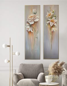 two paintings hanging on the wall above a chair