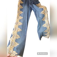 These Nwt Jeans With Gold Lace Embroidery Down Each Leg Are Gorgeous! Size 8 Mixt Brand Strech Pants. Boho Hippy Vibes Blue Embroidered Wide Leg Jeans, Embroidered Denim Wide-leg Bottoms, Embroidered Wide Leg Denim Bottoms, Embroidered Denim Blue Pants, Embroidered Wide-leg Denim Bottoms, Embroidered Wide Leg Denim Blue Jeans, Embroidered Wide Leg Denim Blue Pants, High Waist Embroidered Blue Pants, Blue Embroidered High Waist Pants