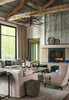 a living room filled with furniture and a fire place