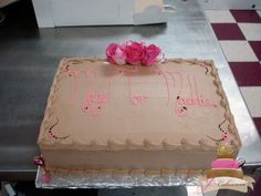 a cake with pink frosting and roses on top that says may i be my mother