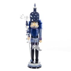 a nutcracker with a blue hat and fur on it's head, holding a star