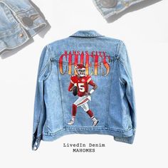 One of a kind hand painted denim jacket for all of my Chiefs fans out there I found this soft blue denim jacket at a local thrift store and decided it was the perfect weight for fall to winter football weather. Layer it with your favorite Cheifs T-shirt or sweater!   Brand: Eddie Bauer size L.  FAQ:  Can you wash this jacket? YES these jackets CAN be washed on cold, delicate or gentle wash.  Do you do custom designs from scratch? YES I DO. Utilizing online thrift stores, or local, with your guidance we can pick a jacket out together to your sizing preferences. Additionally, I will take jackets you already have in your closet and bring them to life! LivedIn Denim is a brand that is focused on sustainability, sourcing jackets from local thrift stores first, with online thrifting as a backup Nfl Fan, Hand Painted Denim Jacket, The Chiefs, Painted Denim Jacket, Painted Jacket, Patrick Mahomes, Vibrant Artwork, Painted Denim, Blue Denim Jacket