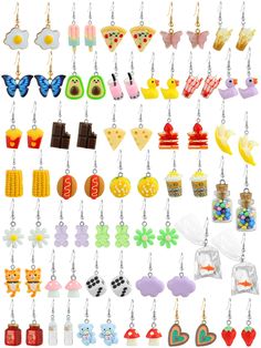 many different earrings are hanging from hooks