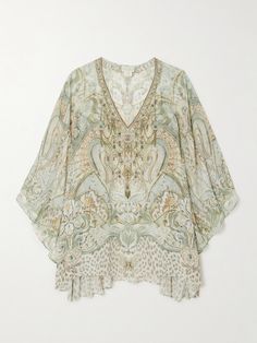 Camilla's kaftan is a glamorous choice for the beach or a pool party. It's made from silk-chiffon with a V-neckline and flowing batwing sleeves that'll drift in the sea breeze. Like most of the label's collections, it's ornately printed with light-reflecting crystals. Chic Silk Kaftan For Beach Cover-up, Bohemian Georgette Beach Dress, Summer Tunic Dress In Georgette, Summer Embellished Georgette Kaftan, Summer Embellished Georgette Dresses, Embellished Silk Kaftan For The Beach, Spring Elegant Embellished Kaftan, Elegant Summer Kaftan For Vacation, Elegant Embellished Spring Kaftan