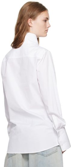 Cotton poplin shirt. · Pointed spread collar at funnel neck · Button closure · Logo hardware at chest · Curved hem · Pleats at two-button French cuffs Supplier color: White White Poplin Tops With Button Cuffs, Poplin Shirt With Fold Down Collar For Work, Collared Poplin Tops With Button Closure, Collared Poplin Top With Button Closure, Daywear Shirt With Button Cuffs And Fold Down Collar, Collared Poplin Shirt With Button Cuffs, White Poplin Top With Spread Collar, Poplin Tops With Button Closure For Work, Poplin Top With Button Closure For Work