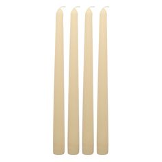 three white candles sitting next to each other