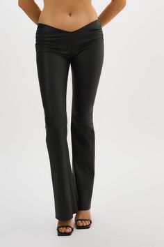 An elevated version of the classic leather trouser, the NADDA low rise leather pants feature a dipped front, ruching at the hips and a flared hem to flatter your shape. Think of them as an effortless foundation for so many outfits.