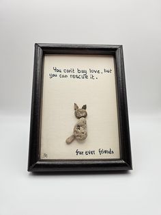 a frame with a stuffed animal in it that says you can't buy love but you cannot rescue it