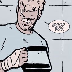 a man holding an object in his hand with a good boy speech bubble above it