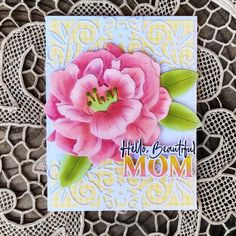 a mothers day card with a pink flower on top of lace doily and the words, hello beautiful mom