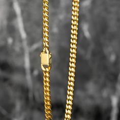 Luxurious Real 18K Gold: Featuring real 18K gold PVD plating on a 6mm 304 Stainless Steel Curb chain, our design boasts flat diamond-cut beveled links for superior shine and a comfortable, strong fit. Tarnish-Resistant Elegance: Crafted to stand the test of time, our Cuban chain features real 18K gold PVD plating on 6mm 304 stainless steel. This advanced plating technique ensures a tarnish-resistant finish, keeping your chain's luxurious shine and appearance intact over time. Hypoallergenic Desi Plating Techniques, Cuban Chain, Bracelet Collection, Curb Chain, High Quality Jewelry, Exquisite Design, Diamond Cut, Luxury Jewelry, Desi