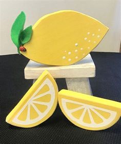 a lemon slice with a ladybug on it sitting on top of a table